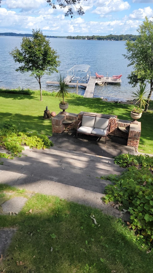 3307 Nokomis NE, Alexandria, MN 56308 - surrounding community with a water view, a boat dock, and a yard