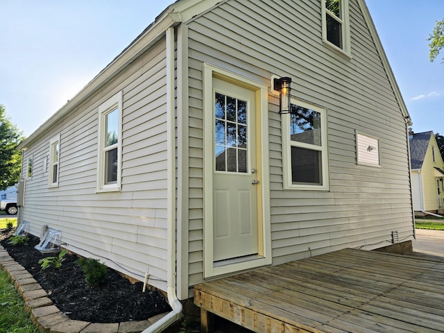 1204 10th St NE, Austin, MN 55912 - view of exterior entry featuring a wooden deck