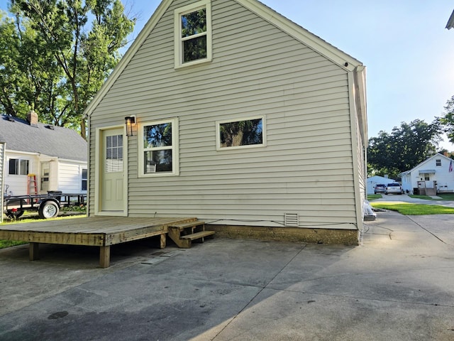 1204 10th St NE, Austin, MN 55912 - rear view of property with a patio
