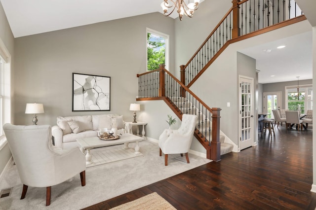 3153 Magnolia Dr, Medina, MN 55340 - living room featuring wood-type flooring, a chandelier, stairs, french doors, and high vaulted ceiling