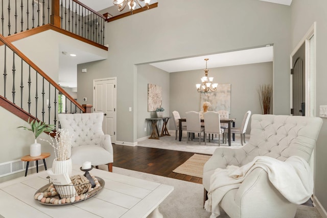 3153 Magnolia Dr, Medina, MN 55340 - living room featuring a chandelier, wood finished floors, stairway, and a high ceiling