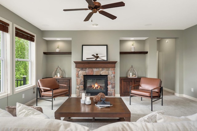 3153 Magnolia Dr, Medina, MN 55340 - carpeted living area featuring ceiling fan, plenty of natural light, and a stone fireplace