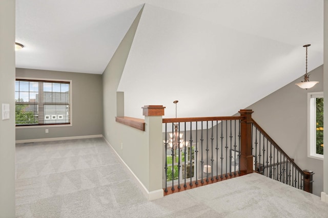 3153 Magnolia Dr, Medina, MN 55340 - hallway with carpet, an upstairs landing, and lofted ceiling