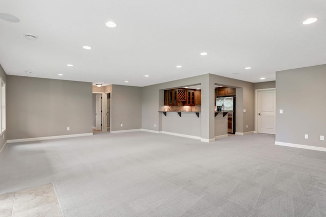 3153 Magnolia Dr, Medina, MN 55340 - unfurnished living room featuring light colored carpet and recessed lighting
