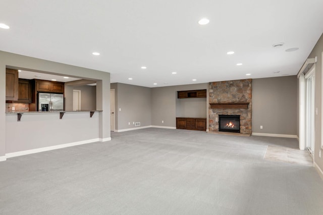 3153 Magnolia Dr, Medina, MN 55340 - unfurnished living room with light carpet, recessed lighting, and a fireplace