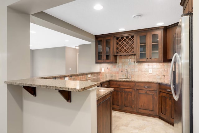 3153 Magnolia Dr, Medina, MN 55340 - indoor wet bar with freestanding refrigerator, recessed lighting, and backsplash