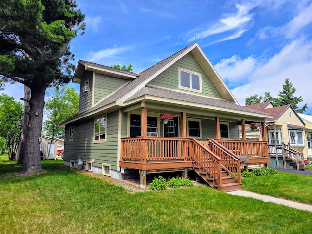 825 2nd Ave, Grand Rapids, MN 55744 - view of front facade featuring roof with shingles, covered porch, and a front yard