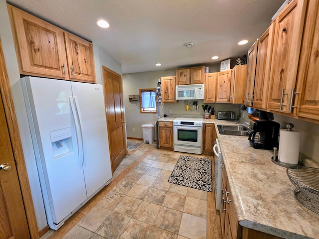 825 2nd Ave, Grand Rapids, MN 55744 - kitchen with white appliances, light countertops, light stone finish floors, and recessed lighting