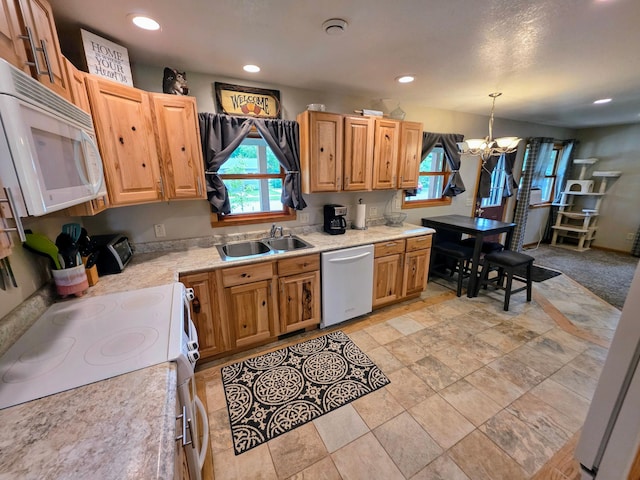 825 2nd Ave, Grand Rapids, MN 55744 - kitchen featuring white appliances, light countertops, a chandelier, recessed lighting, and hanging light fixtures