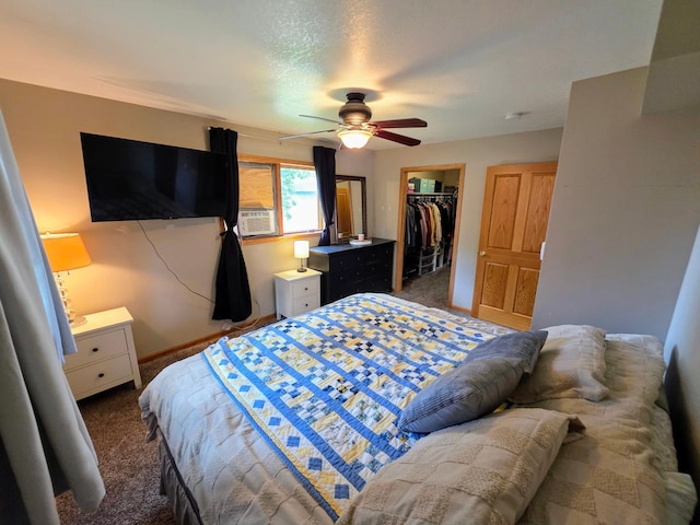 825 2nd Ave, Grand Rapids, MN 55744 - carpeted bedroom featuring a closet, a walk in closet, a ceiling fan, and cooling unit