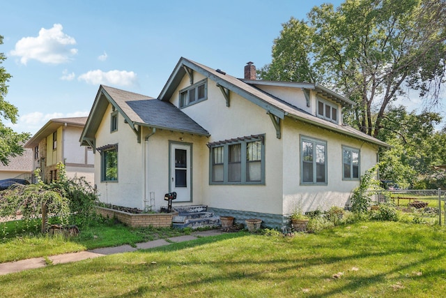 116 3rd Ave SE, Osseo, MN 55369 - view of front of home with stucco siding and a chimney