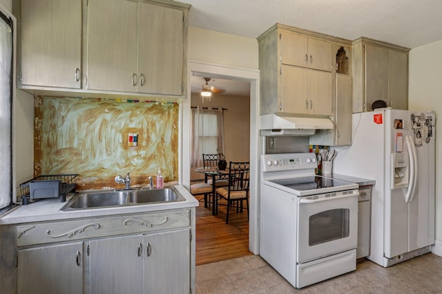 116 3rd Ave SE, Osseo, MN 55369 - kitchen featuring white appliances, under cabinet range hood, light countertops, and a ceiling fan