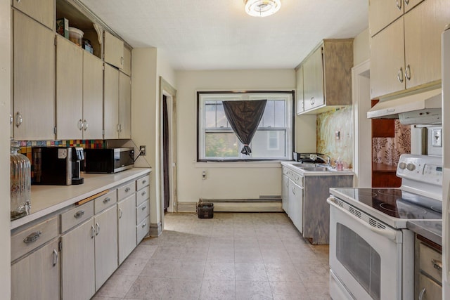 116 3rd Ave SE, Osseo, MN 55369 - kitchen with white electric range oven, under cabinet range hood, baseboard heating, light countertops, and tasteful backsplash