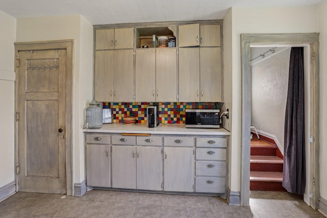 116 3rd Ave SE, Osseo, MN 55369 - kitchen with stainless steel microwave, light countertops, and decorative backsplash