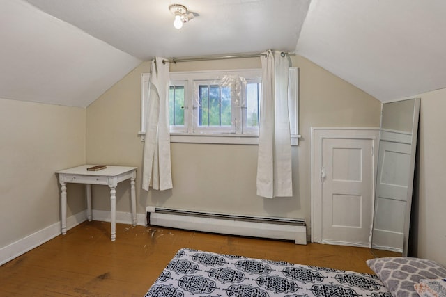 116 3rd Ave SE, Osseo, MN 55369 - additional living space featuring a baseboard radiator, vaulted ceiling, and wood finished floors