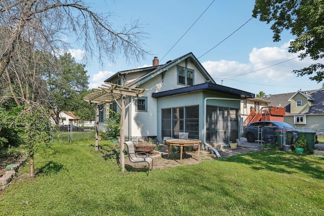 116 3rd Ave SE, Osseo, MN 55369 - rear view of property with a sunroom, a pergola, a fenced backyard, and stucco siding