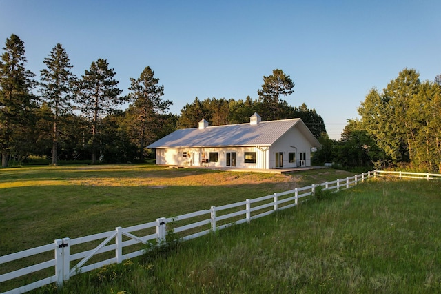 1650 Gunn Rd, Grand Rapids, MN 55744 - view of front of home with a chimney and a metal roof