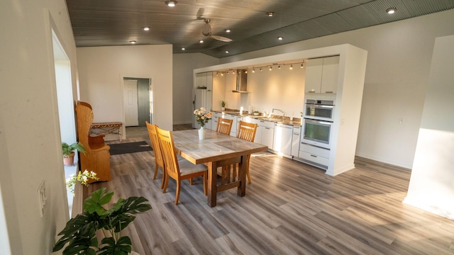 1650 Gunn Rd, Grand Rapids, MN 55744 - dining space with lofted ceiling, wood finished floors, and recessed lighting
