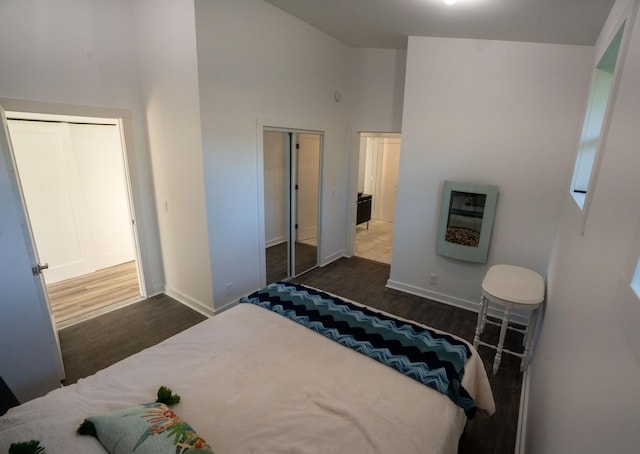 1650 Gunn Rd, Grand Rapids, MN 55744 - bedroom with wood finished floors, heating unit, and high vaulted ceiling