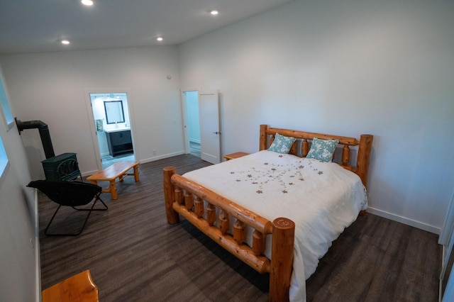 1650 Gunn Rd, Grand Rapids, MN 55744 - bedroom featuring a wood stove, wood finished floors, recessed lighting, and vaulted ceiling