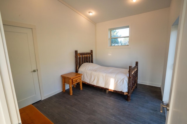 1650 Gunn Rd, Grand Rapids, MN 55744 - bedroom with lofted ceiling and dark wood-type flooring