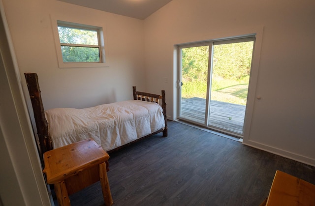 1650 Gunn Rd, Grand Rapids, MN 55744 - bedroom with access to exterior, dark wood-type flooring, multiple windows, and vaulted ceiling