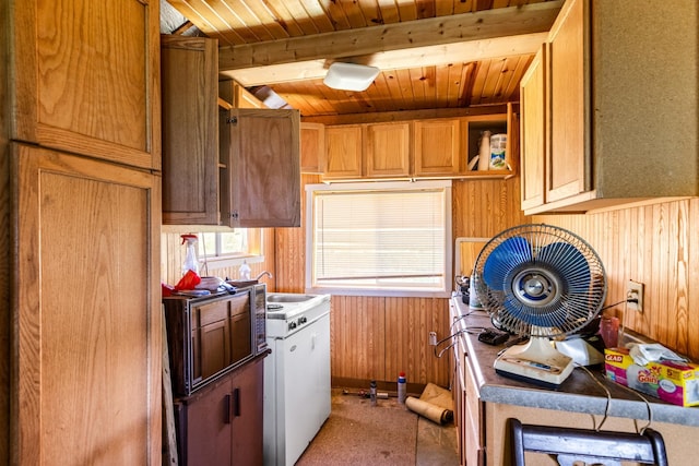 1031 23rd St Unit A, Prairie Lake Twp, WI 54728 - kitchen with open shelves, wooden walls, wooden ceiling, and carpet flooring