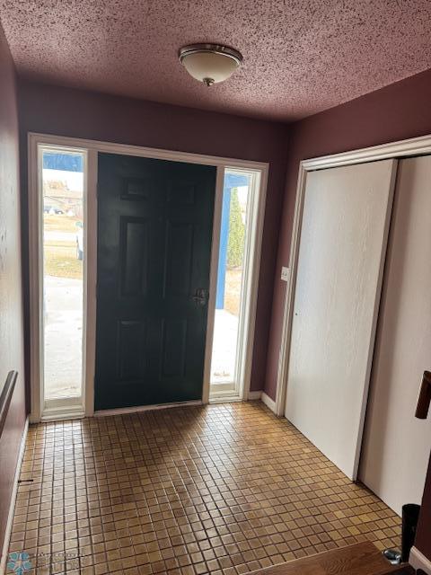 214 7th St, Hatton, ND 58240 - entrance foyer featuring a textured ceiling