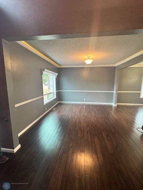 214 7th St, Hatton, ND 58240 - unfurnished room featuring a textured ceiling, wood finished floors, and ornamental molding