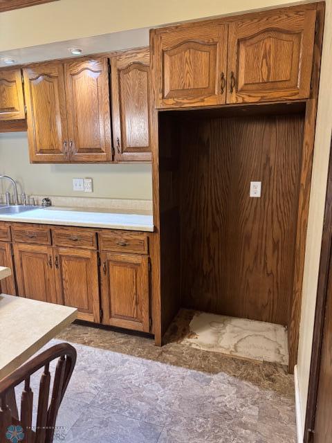 214 7th St, Hatton, ND 58240 - kitchen with brown cabinetry and light countertops