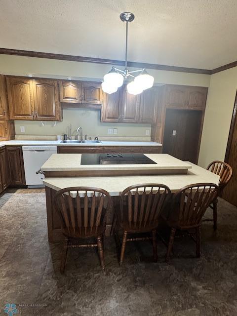214 7th St, Hatton, ND 58240 - kitchen with white dishwasher, black electric stovetop, light countertops, a textured ceiling, and ornamental molding