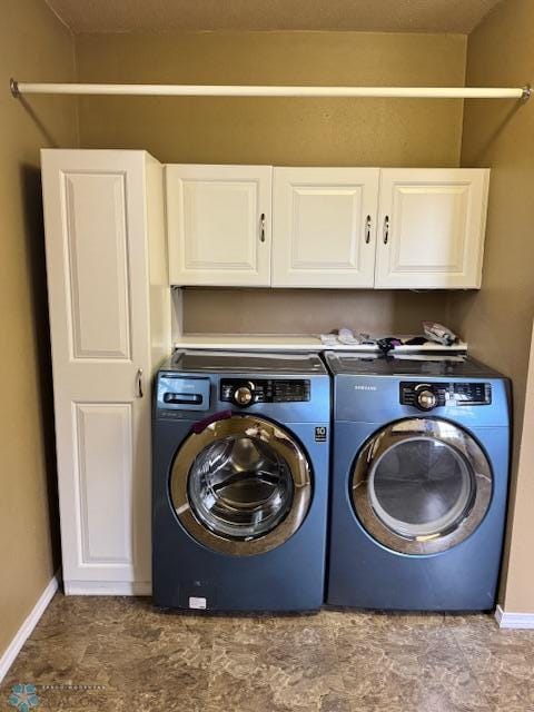 214 7th St, Hatton, ND 58240 - washroom featuring cabinet space and independent washer and dryer