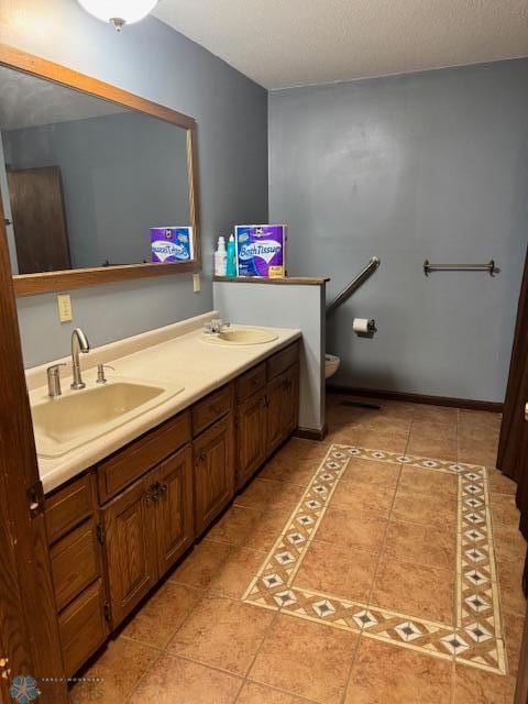 214 7th St, Hatton, ND 58240 - bathroom featuring tile patterned floors and double vanity