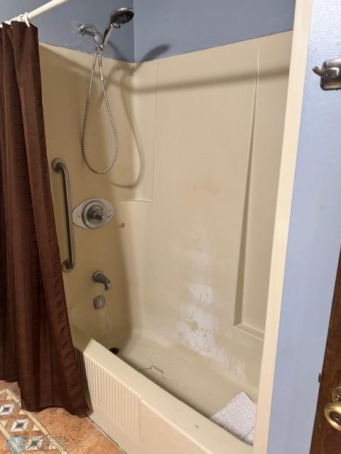 214 7th St, Hatton, ND 58240 - bathroom with shower / tub combo and tile patterned flooring