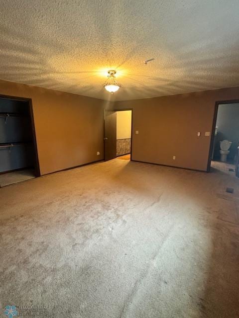 214 7th St, Hatton, ND 58240 - spare room with light carpet and a textured ceiling