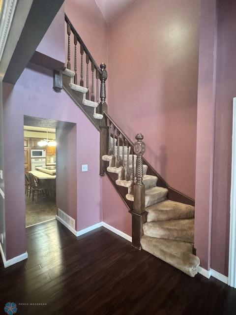 214 7th St, Hatton, ND 58240 - staircase with wood finished floors and baseboards