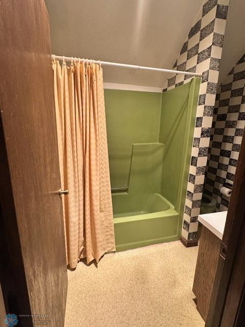 214 7th St, Hatton, ND 58240 - bathroom with vanity, shower / tub combo, and lofted ceiling