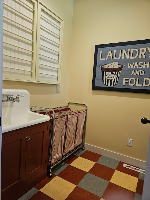 1504 4th St NE, Willmar, MN 56201 - bathroom with tile patterned floors and a sink