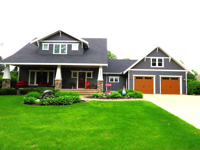 1504 4th St NE, Willmar, MN 56201 - craftsman-style home with covered porch, a front lawn, driveway, and a shingled roof