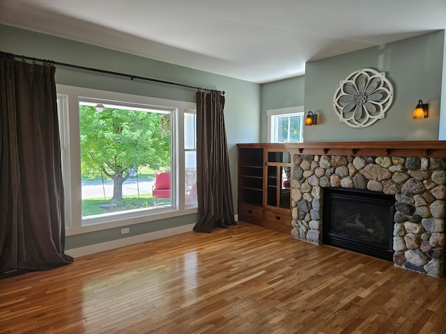 1504 4th St NE, Willmar, MN 56201 - living room featuring wood finished floors and a fireplace