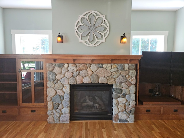 1504 4th St NE, Willmar, MN 56201 - detailed view of wood finished floors and a stone fireplace