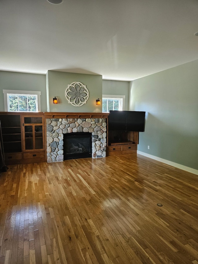 1504 4th St NE, Willmar, MN 56201 - living room featuring wood-type flooring and a fireplace