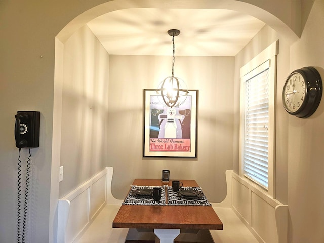 1504 4th St NE, Willmar, MN 56201 - dining room featuring arched walkways and a chandelier