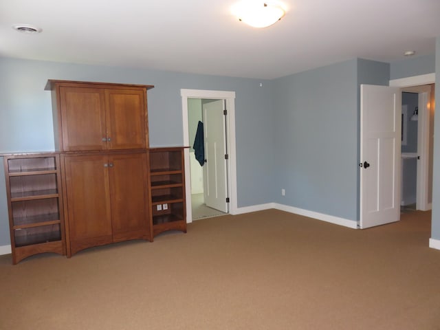 1504 4th St NE, Willmar, MN 56201 - unfurnished bedroom with light colored carpet
