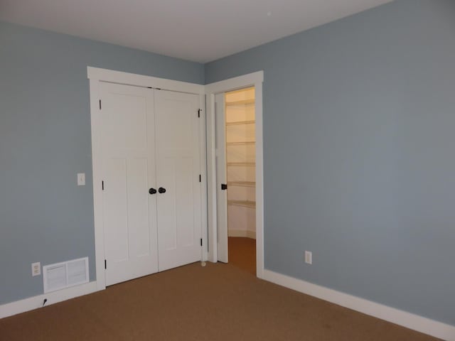 1504 4th St NE, Willmar, MN 56201 - unfurnished bedroom with carpet flooring and a closet