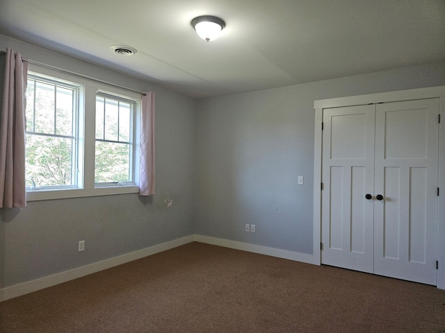1504 4th St NE, Willmar, MN 56201 - unfurnished bedroom with carpet floors and a closet