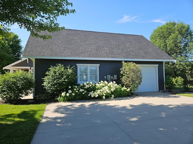 1504 4th St NE, Willmar, MN 56201 - view of property exterior with a shingled roof, a garage, and driveway