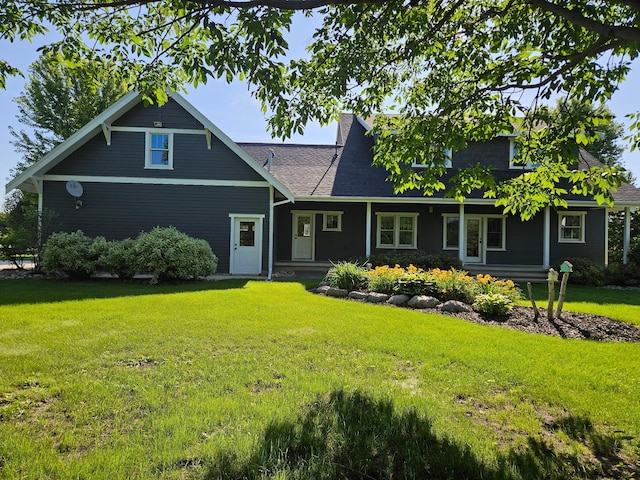 1504 4th St NE, Willmar, MN 56201 - view of front of house with a front yard and a shingled roof