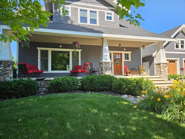 1504 4th St NE, Willmar, MN 56201 - craftsman-style house featuring covered porch, stone siding, and a front yard