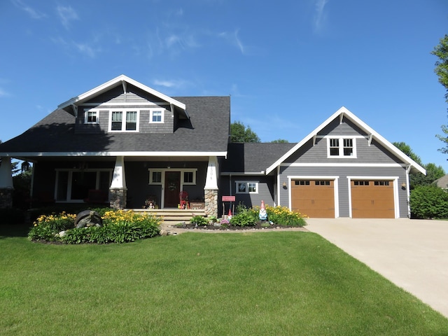 1504 4th St NE, Willmar, MN 56201 - craftsman house with covered porch, a front yard, driveway, a garage, and a shingled roof